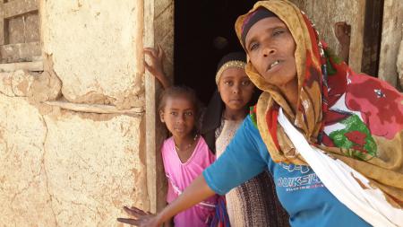 Kedija outside her house, Ethiopia Kedija outside her house, Ethiopia